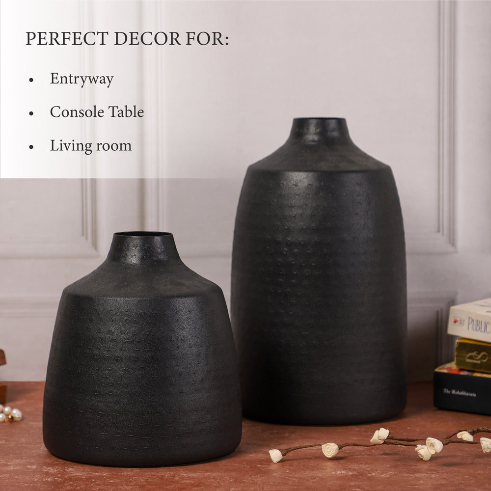 Two black decorative vases displayed on a table, perfect for entryway, console table, or living room decor