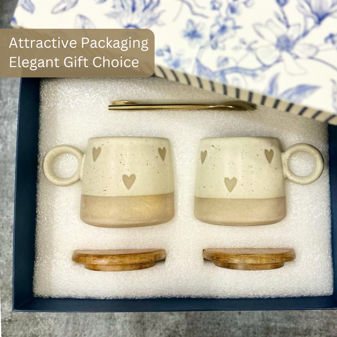 Gift set of two ceramic mugs with heart patterns, wooden lids, golden spoons, packaged in an elegant blue box