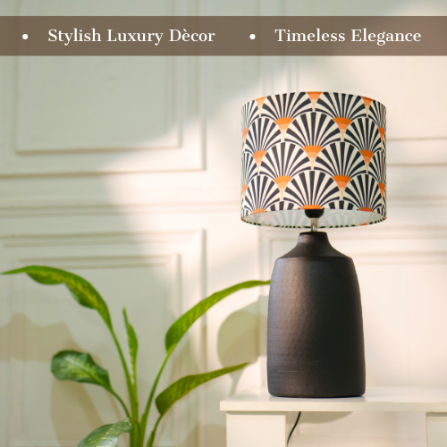Elegant table lamp with colorful artistic shade on wooden base, placed on a desk