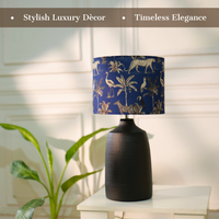 Elegant table lamp with colorful artistic shade on wooden base, placed on a desk — thumbnail