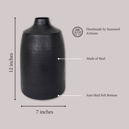 Black steel vase with dimensions of 12 inches tall and 7 inches wide, featuring an anti-skid felt bottom and handcrafted by seasoned artisans