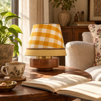 Haldi Gingham empire lamp shade on the RIO mango wood Turtle table lamp in a sunlit living room — thumbnail