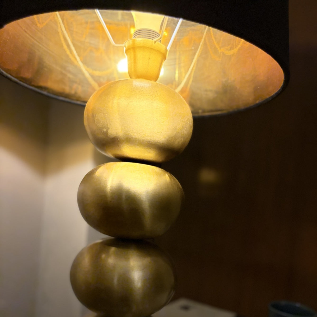 Gold foil lining of Raat Velvet Drum Lamp Shade glowing